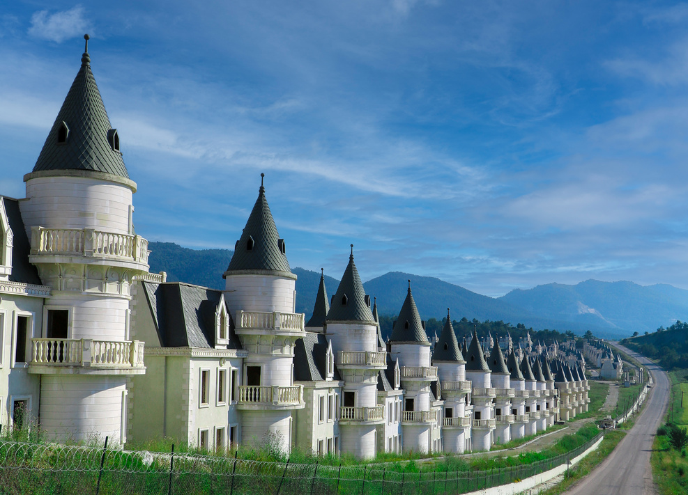 A clear sky over the unfinished castle villas of Burj Al Babas, showcasing their haunting uniformity, Mudurnu, Bolu, Türkiye