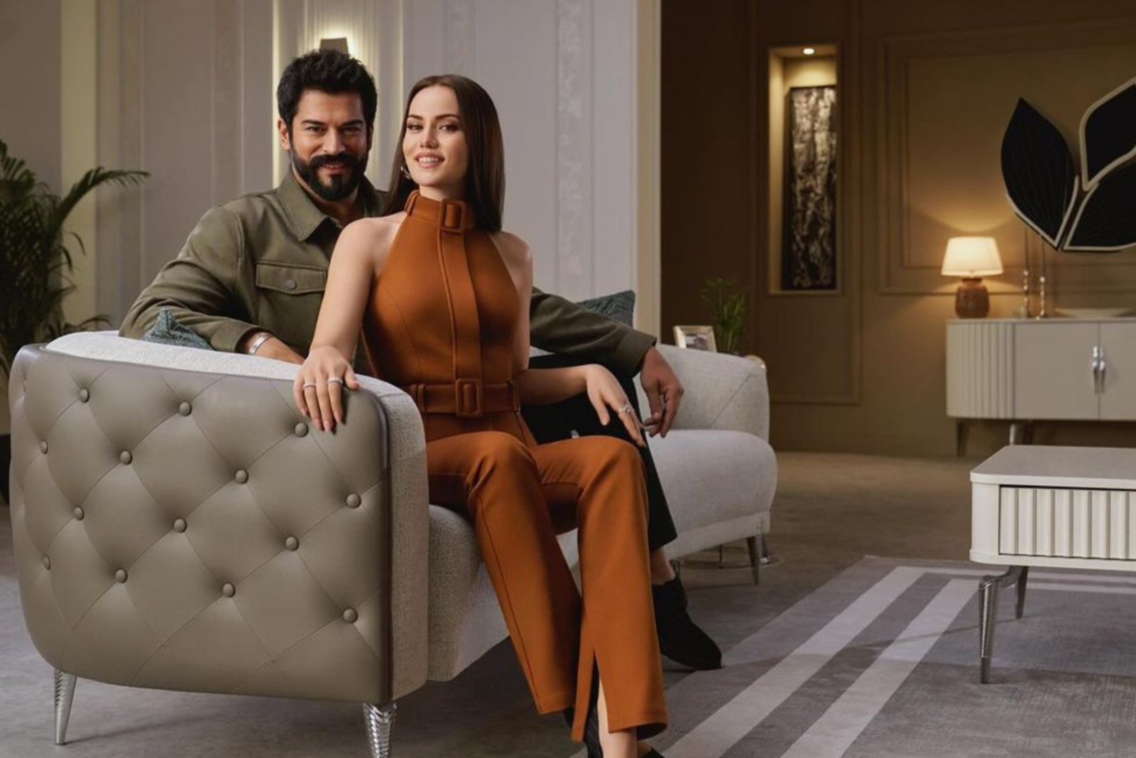 Fahriye Evcen and Burak Ozcivit pose for a furniture brand advertisement