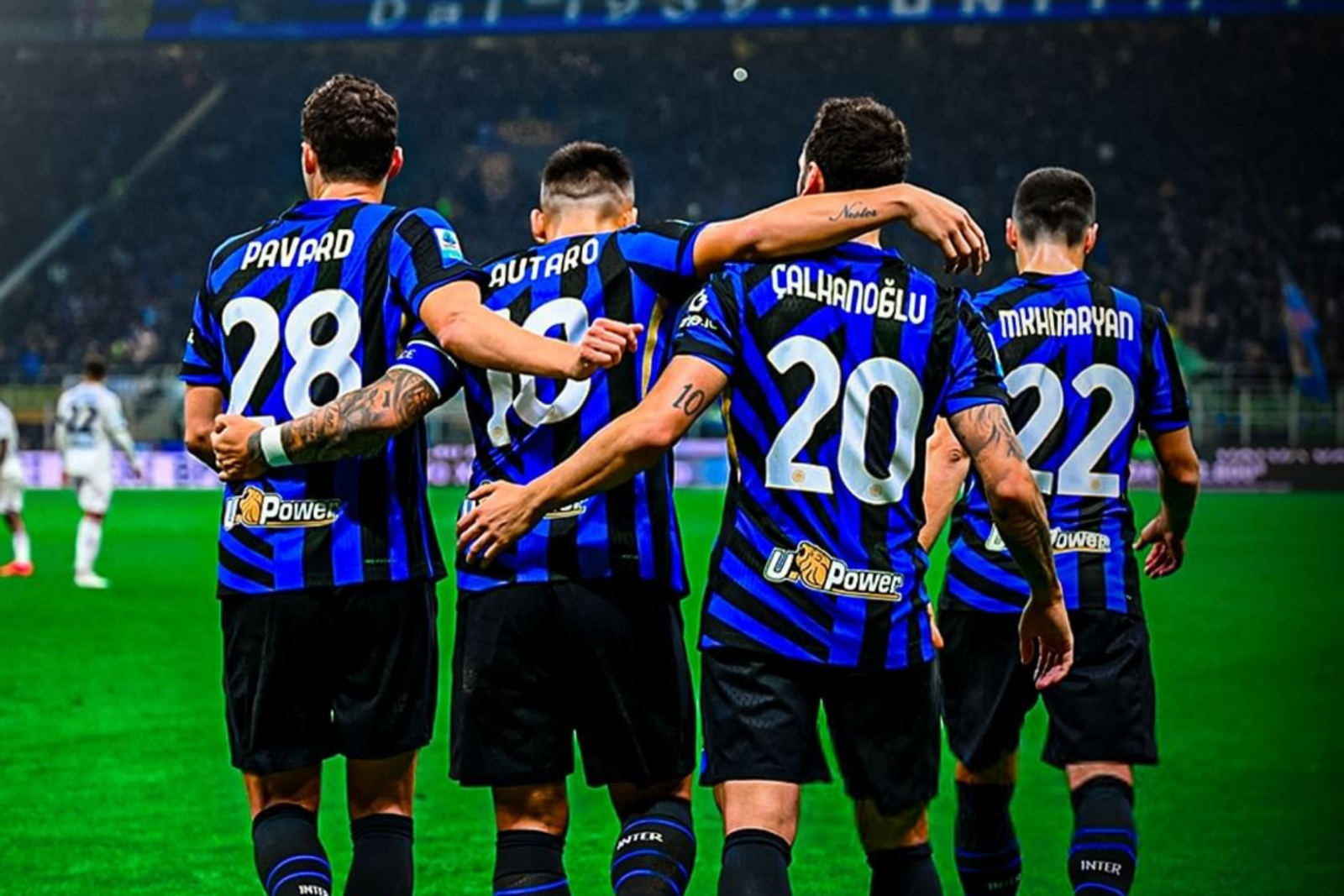 Hakan Calhanoglu celebrates with teammates during Inter’s match in Milan