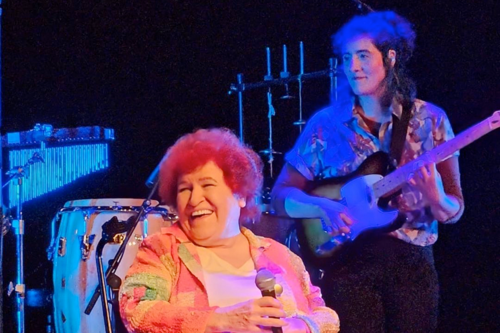 Turkish folk singer Selda Bagcan smiling full of happiness while on stage in Little Waves festival, Genk, Belgium, April 23, 2024