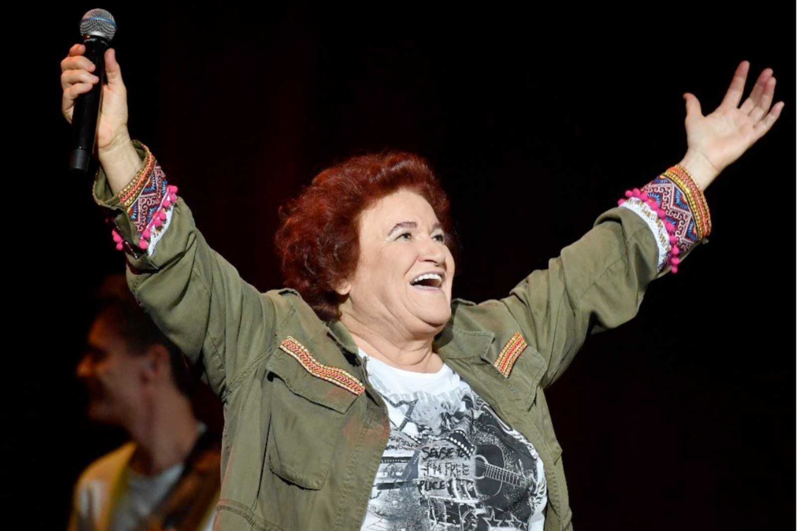 Turkish folk icon Selda Bagcan gestures to thank her fans at the end of her Kusadasi Youth Festival performance