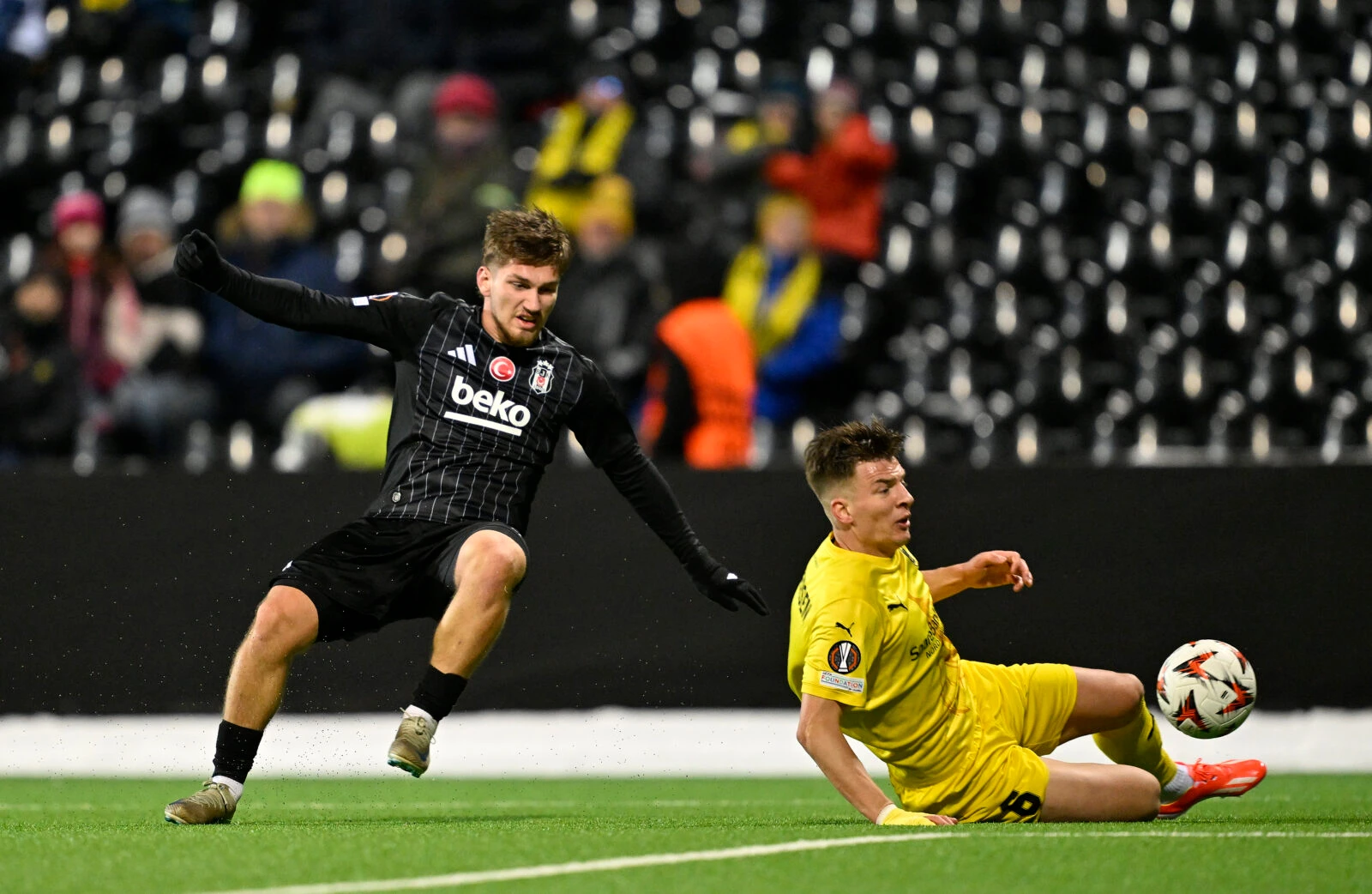 Jostein Gundersen (R) of Bodo/Glimt in action against Semih Kilicsoy (L) of Besiktas 