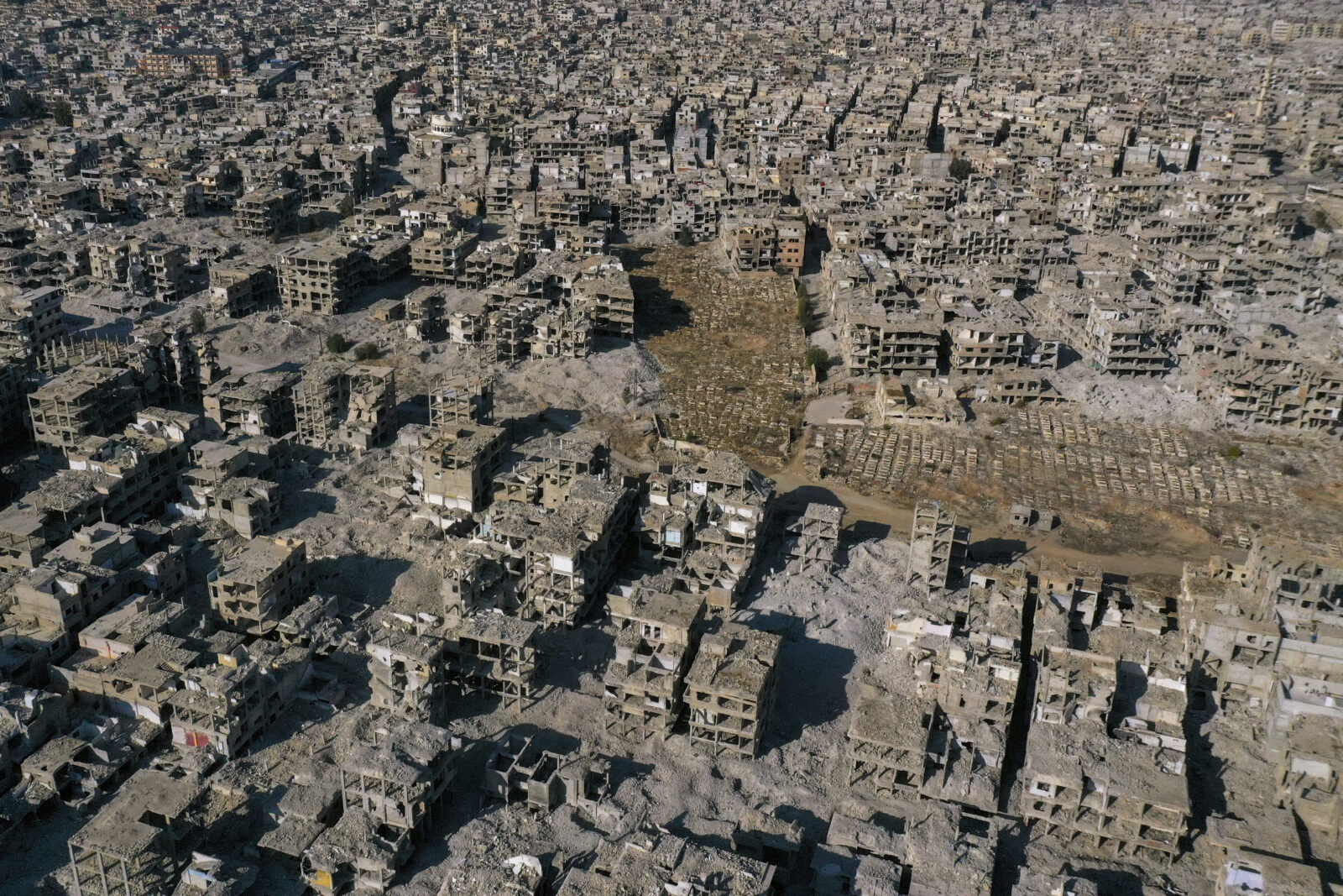 Families return to Yarmuk cemetery after Assad's fall in Syria