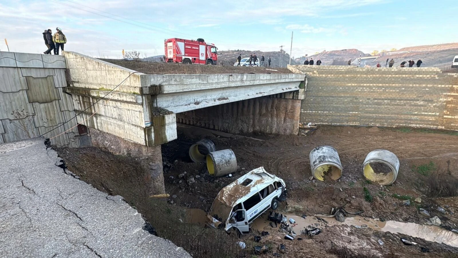 A shuttle bus lies in a creek bed after an accident in Tuzla, Istanbul, Türkiye, on Jan. 24, 2025.