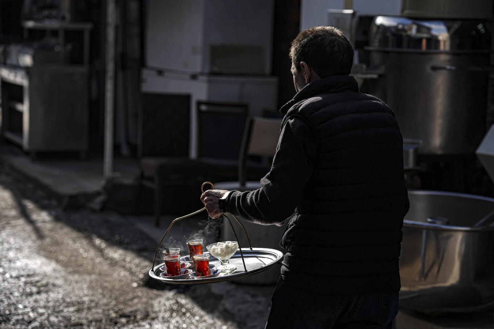 A man distributes Turkish tea