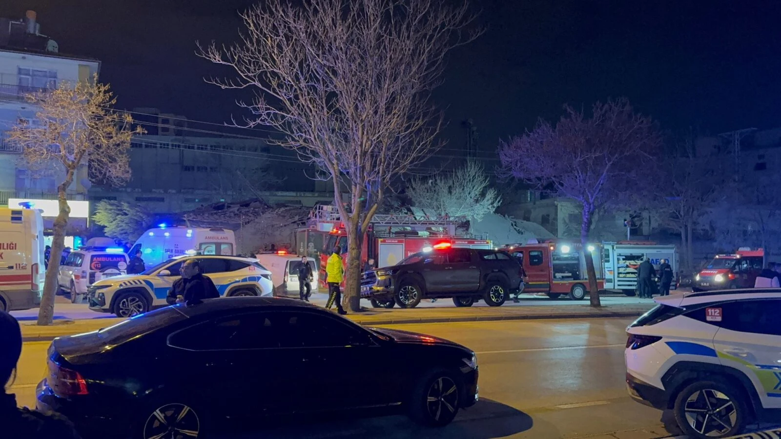 Photo shows the collapsed building with police and emergency medical teams.