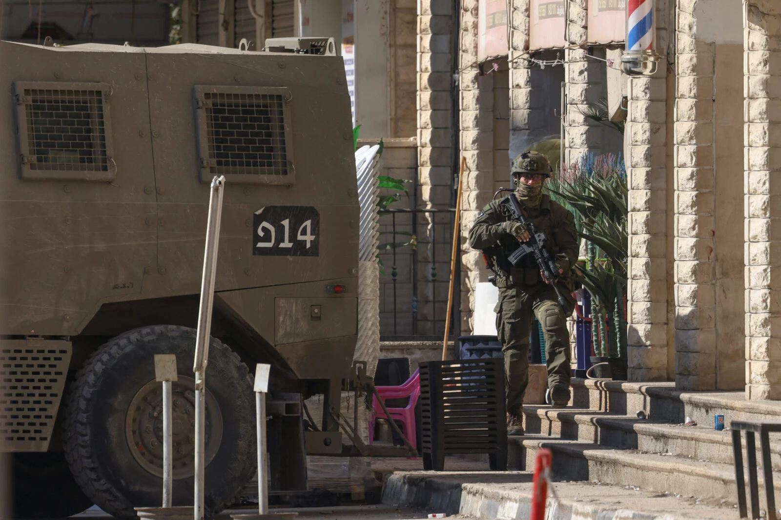 An Israeli soldiers walks 