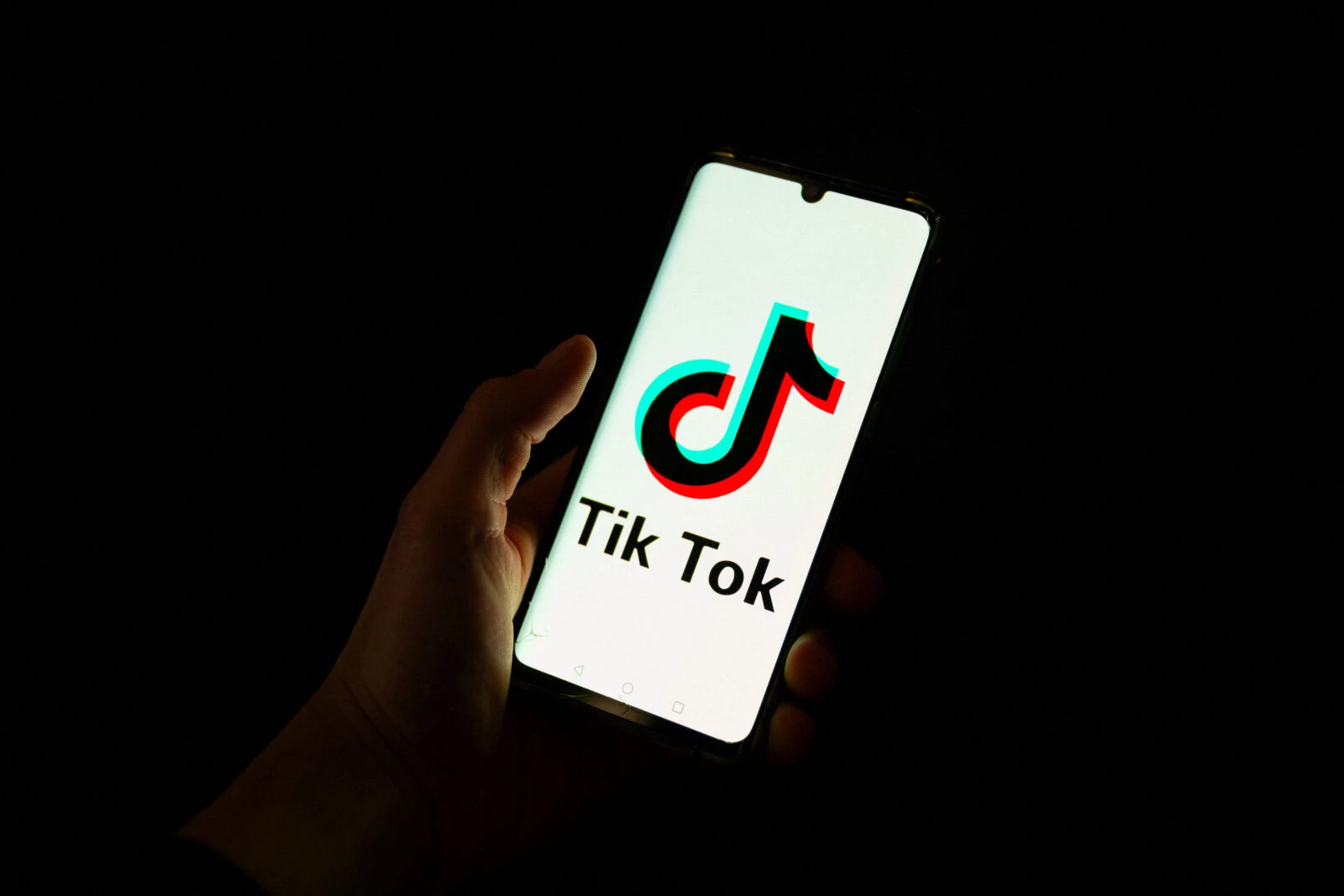 File photo shows a man holding a smartphone displaying the logo of Chinese social media platform Tiktok in an office in Paris, France, on Apr. 19, 2024. (AFP Photo)