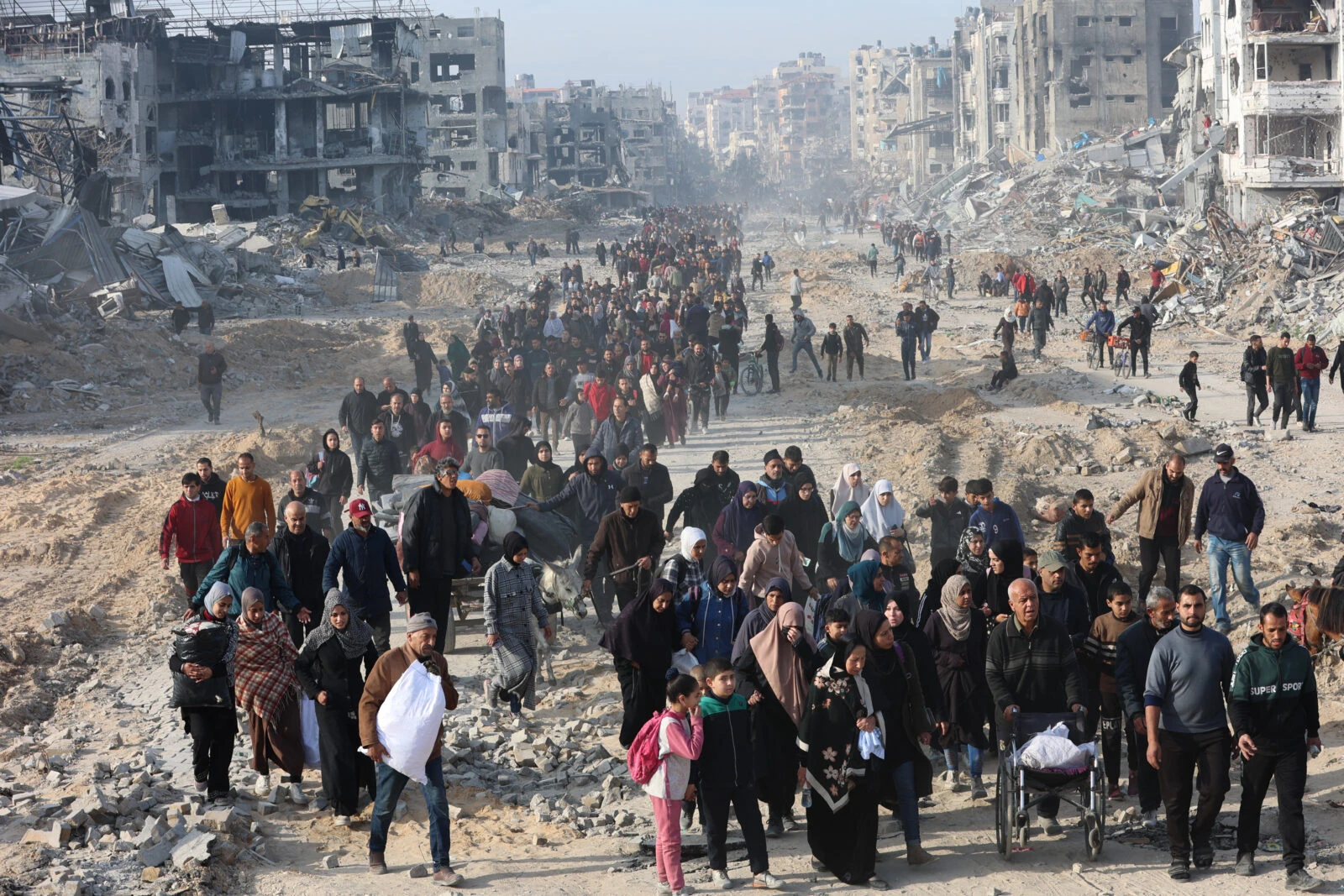 displaced Palestinians walk