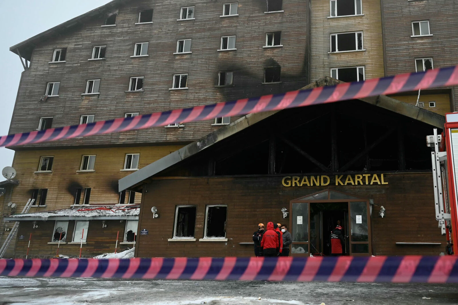 Turkish emergency personnel operate on the aftermath of a fire that broke out at the Grand Kartal Hotel