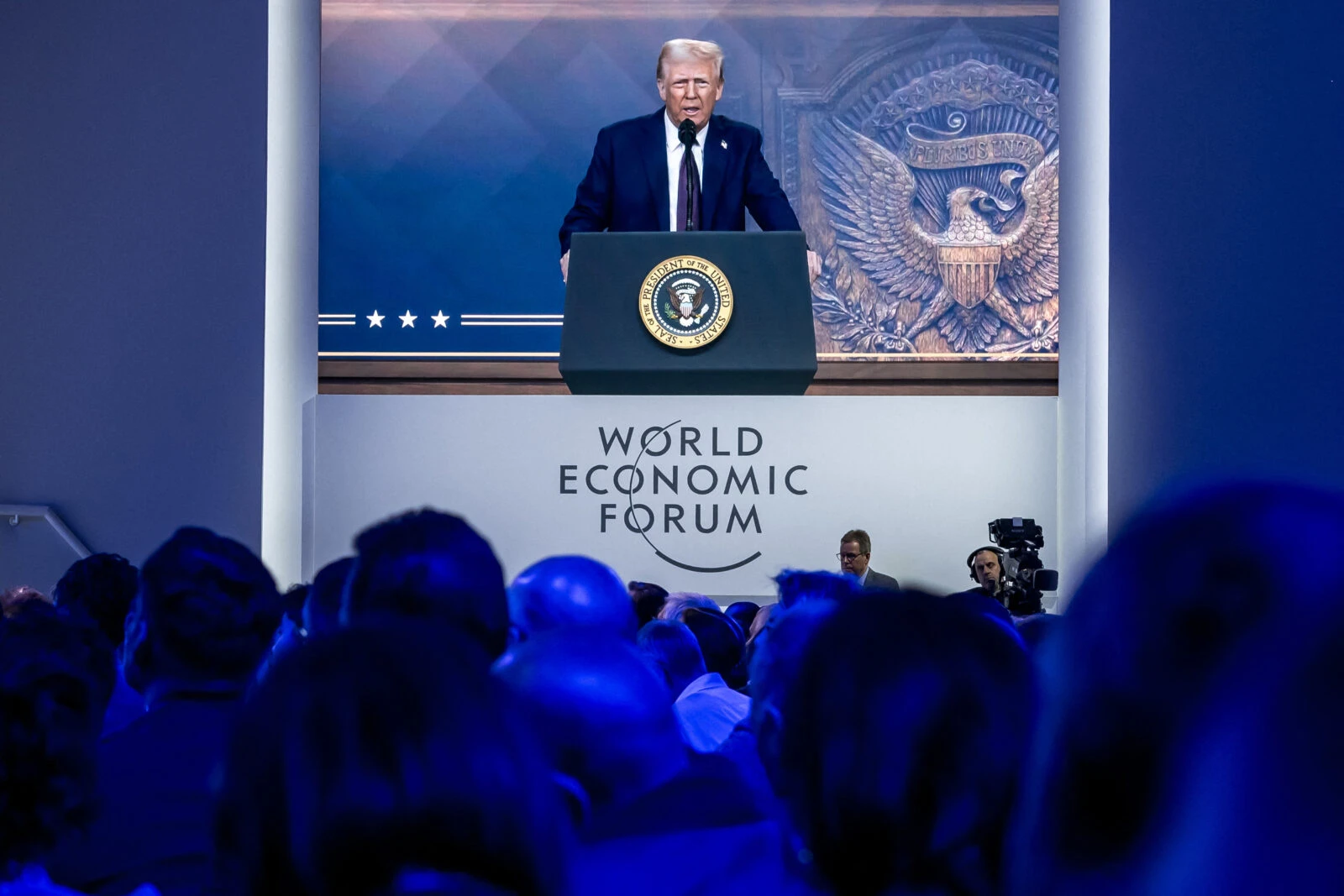 US President Donald Trump is seen on a giant screen during his address by video conference at the World Economic Forum (WEF) annual meeting in Davos, Switzerland. (AFP Photo)