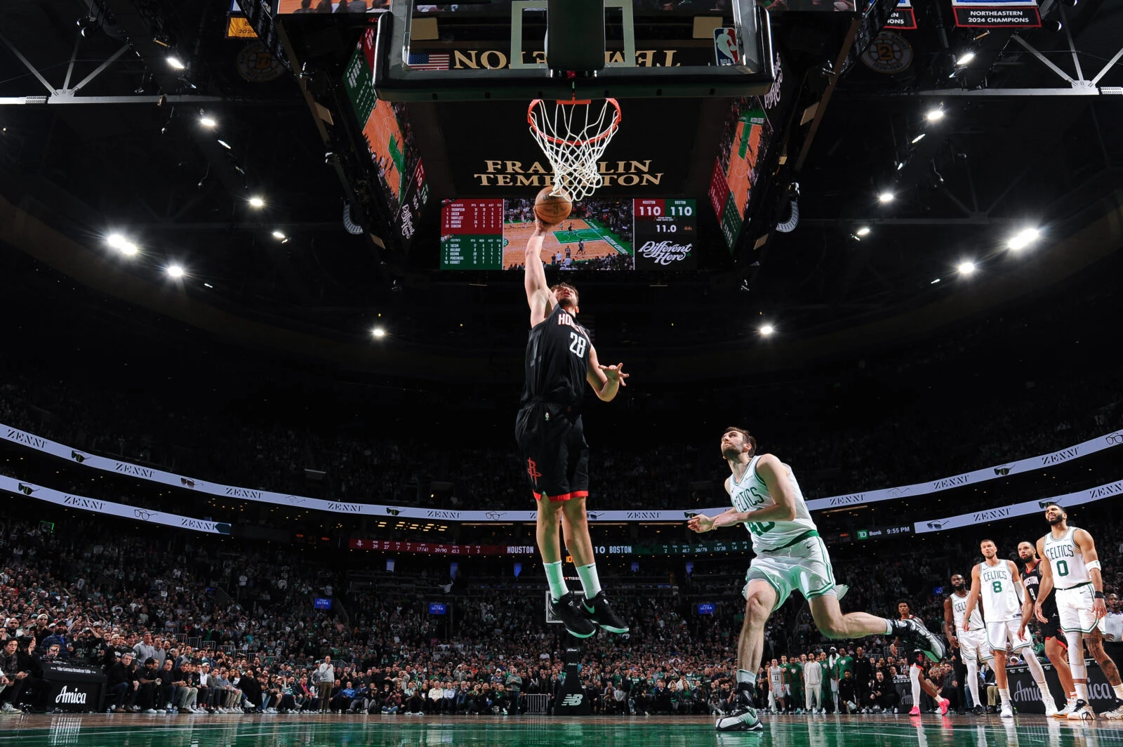 Photo shows Alperen Sengun dunking at TD Garden