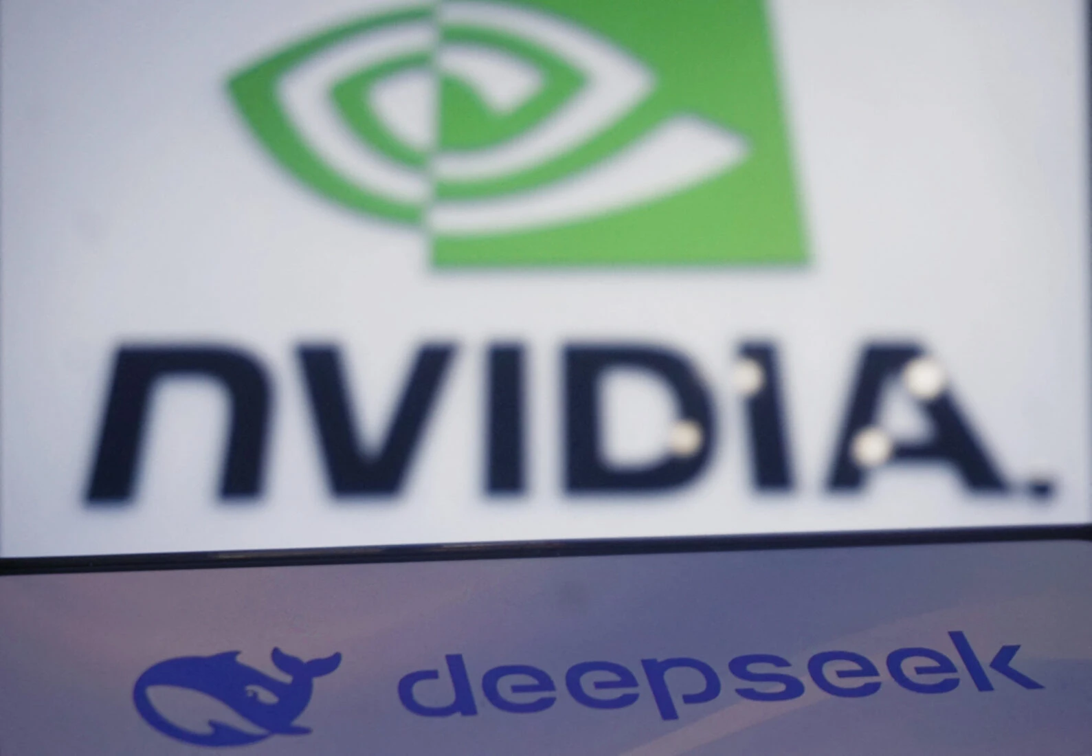 This photo illustration shows the DeepSeek and Nvidia logos on screens in Hangzhou, in China's eastern Zhejiang province on Jan. 27, 2025. Fears of upheaval in the AI gold rush rocked Wall Street, following the emergence of a popular ChatGPT-like model from China, with US President Donald Trump saying it was a "wake-up call" for Silicon Valley. (AFP Photo)