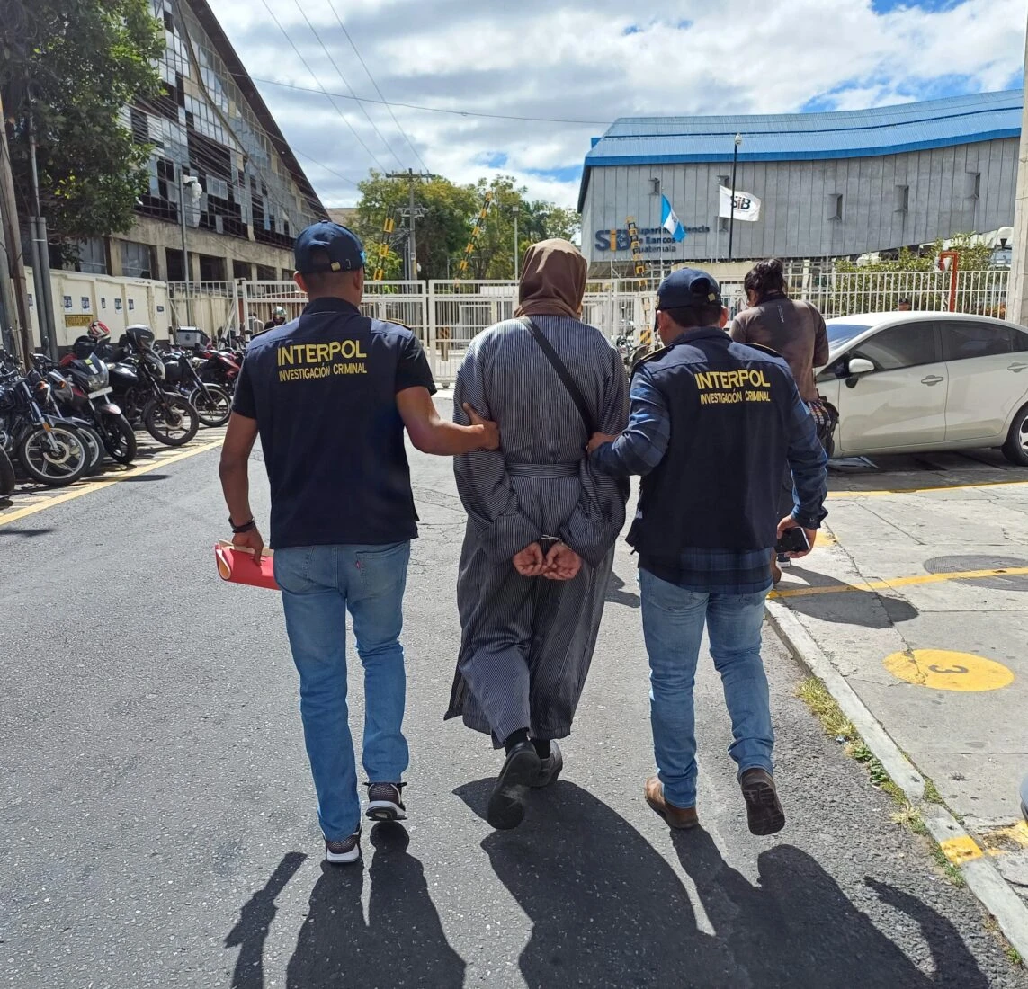 Yoel Alter, leader of Lev Tahor, is escorted by Interpol officers following his arrest for child abuse and human trafficking in Guatemala on January 29, 2025.