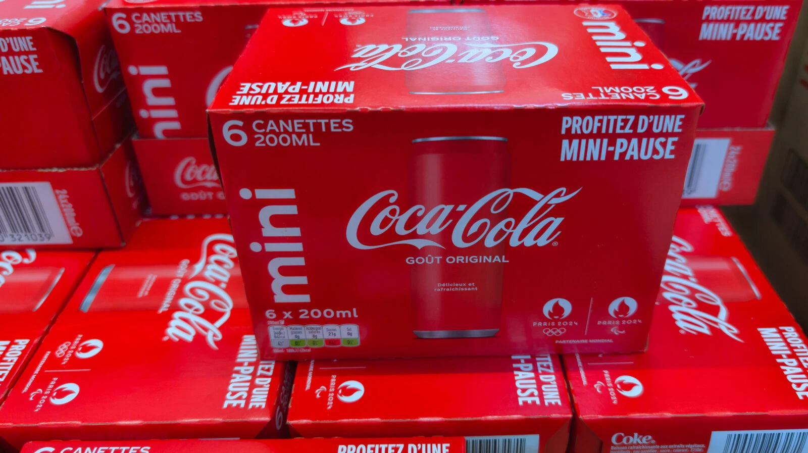 File photo shows packs of Coca-Cola Mini cans displayed for sale in a French supermarket. (Adobe Stock Photo)