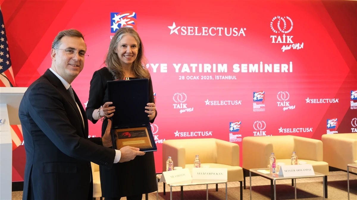 TAIK Chairman Murat Ozyegin presents a plaque to U.S. Consul General in Istanbul, Julie A. Eadeh