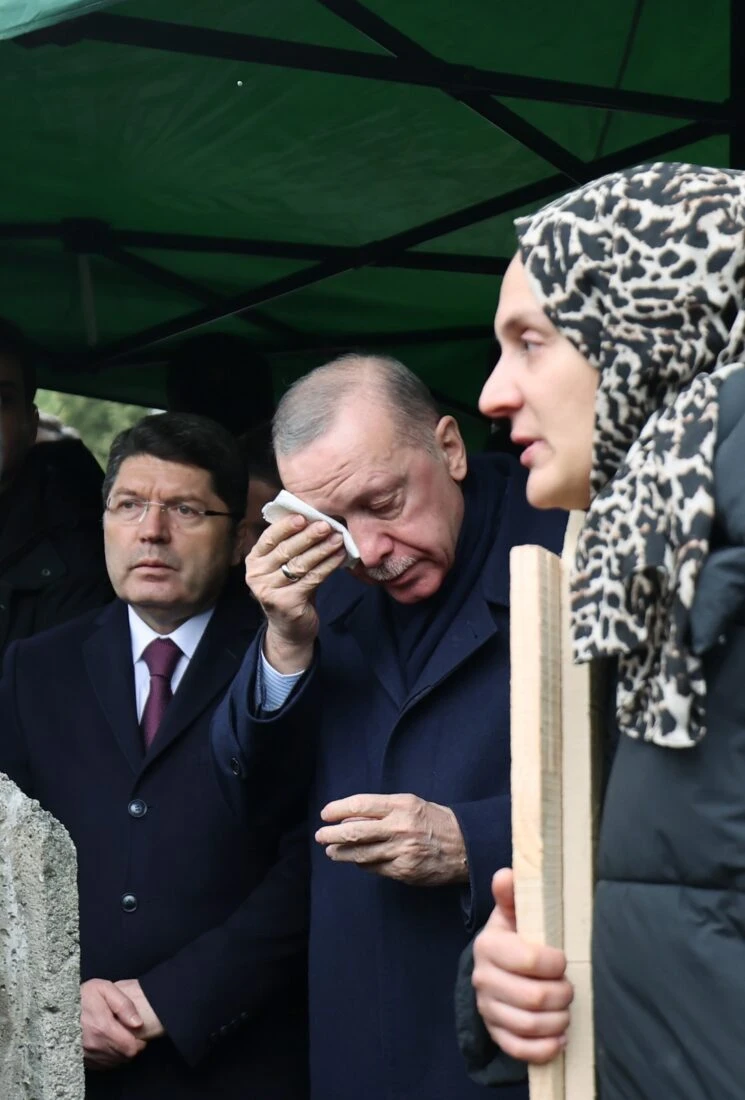 Turkish president erdogan his wiping tears with a piece of cloth 