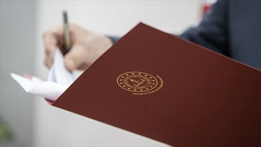 a folder bearing the emblem of the Turkish Ministry of National Education,