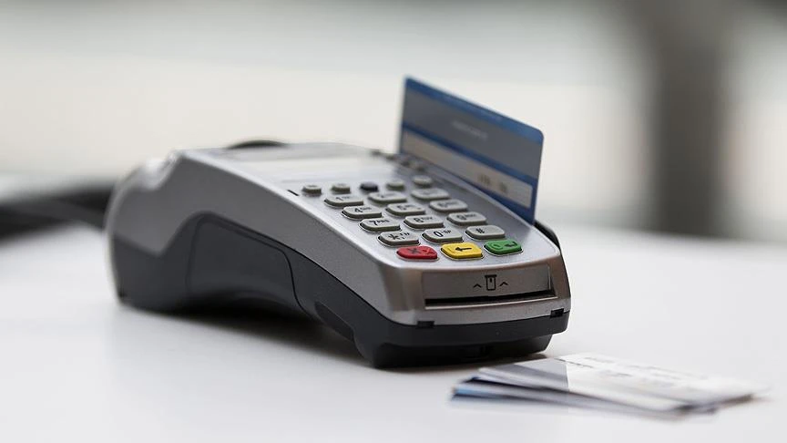 File photo shows a TROY card inserted into a point-of-sale (POS) terminal. (AA Photo)