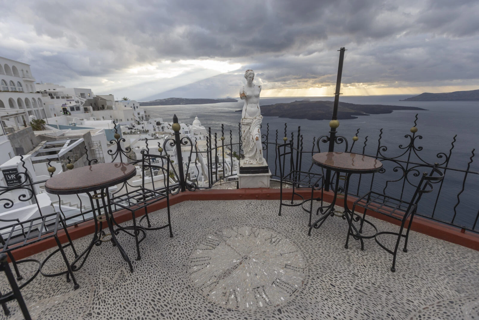 A broken statue of the ancient Greek goddess Aphrodite lying in Fira, Santorini.