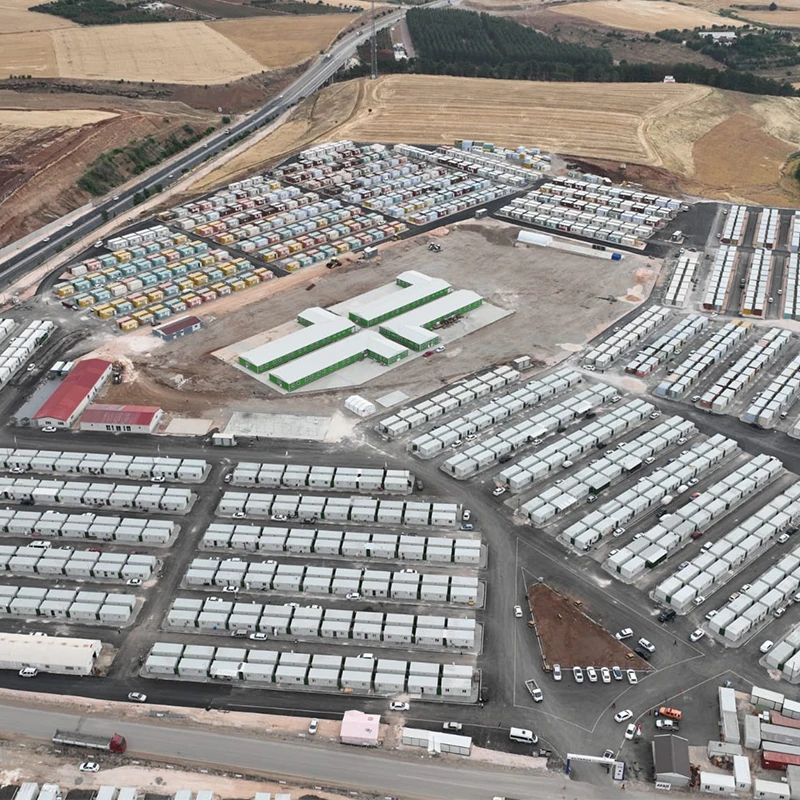 An aerial view of a large temporary housing settlement 