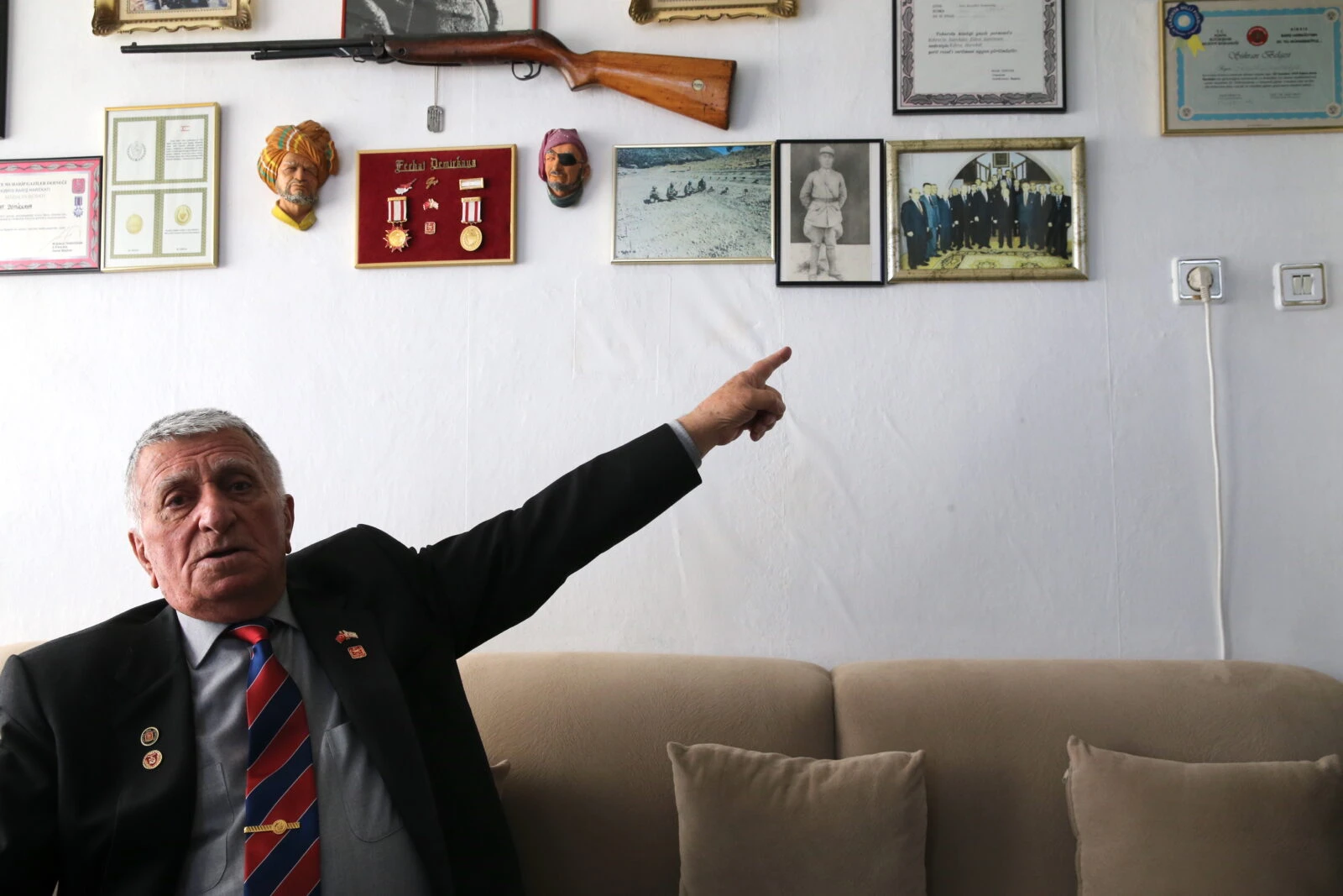 Ferhat Demirkaya, a Cyprus war veteran, reflecting on his memories from the frontlines in Konya.