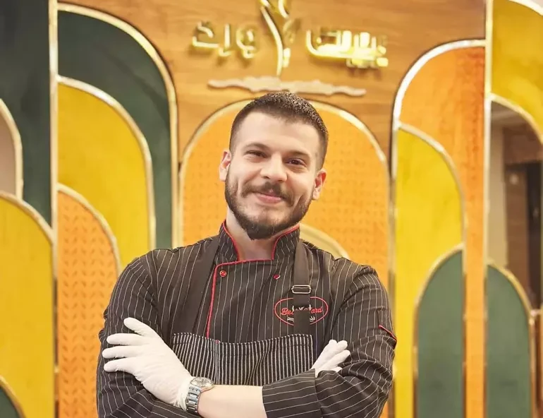 Karam Darwich, a 27-year-old chef at Gül Evi (Bayt Ward) in Istanbul, Türkiye, poses in his restaurant.