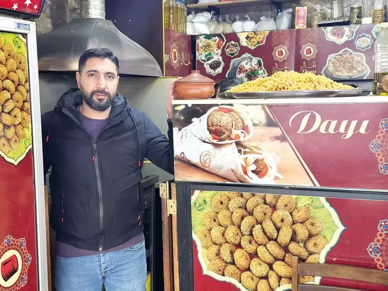 A portrait of Hamed Gurbal, the 39-year-old owner of Alkhal Restaurant in Istanbul, Türkiye.