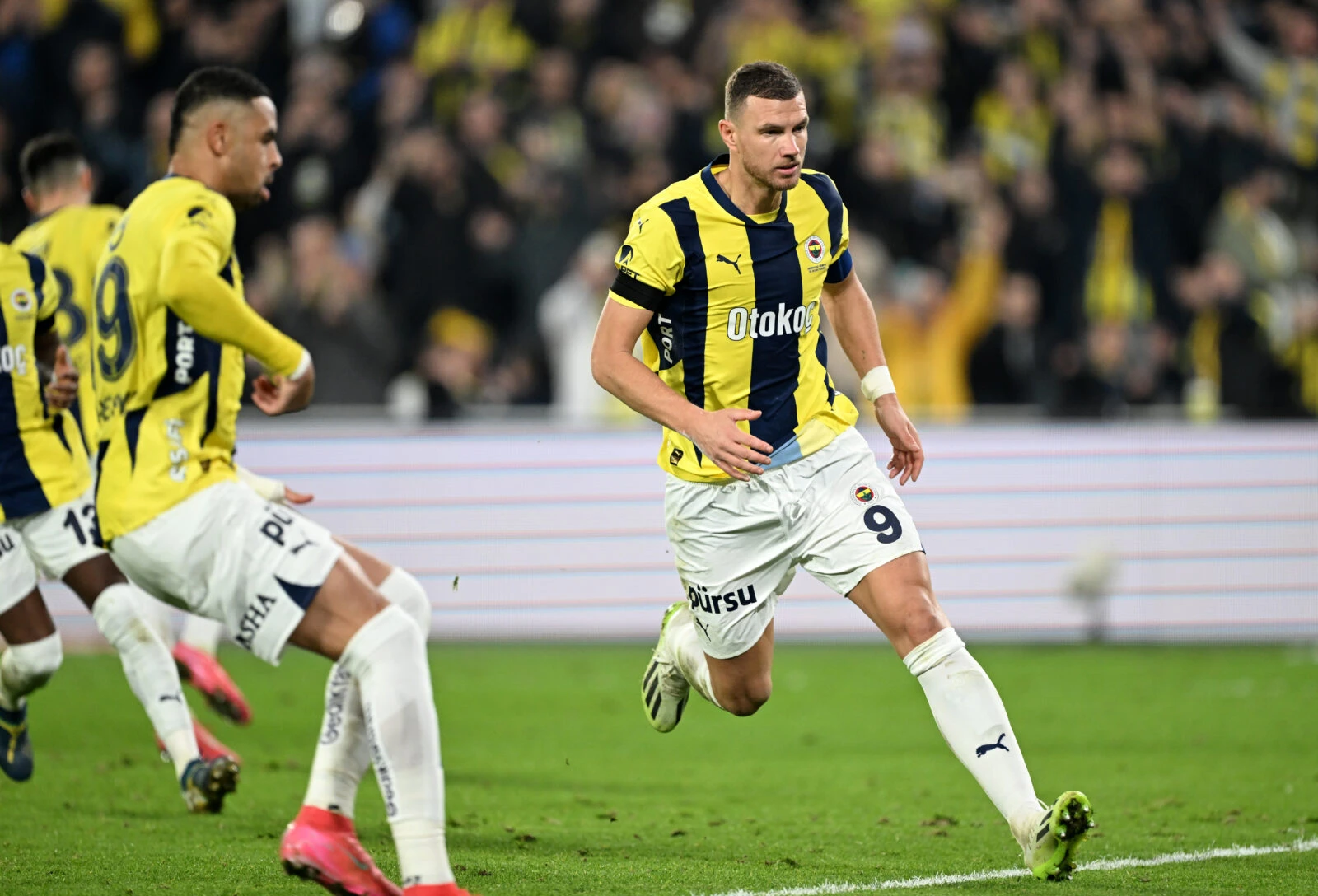 Photo shows Edin Dzeko (9) of Fenerbahce celebrating after scoring a goal.