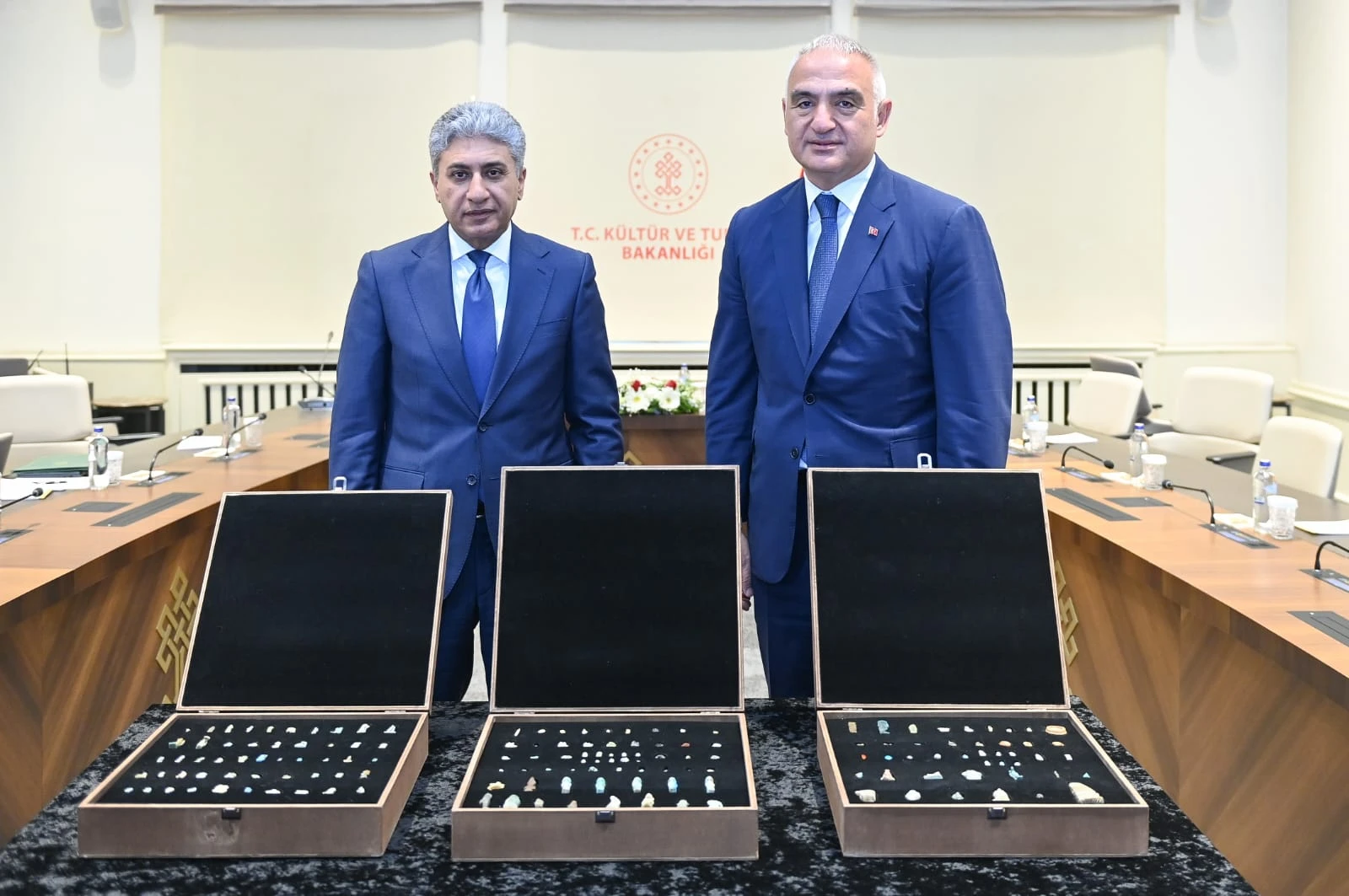 Minister Mehmet Nuri Ersoy and Egypt's Minister Sherif Fathy at the ceremony marking the return of 152 historical artifacts to Egypt, celebrating 100 years of diplomatic relations.