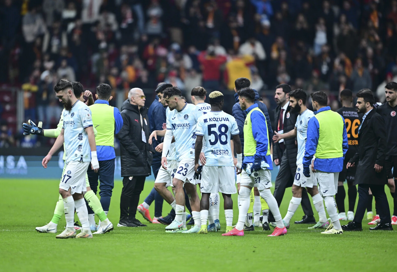 Photo shows Adana Demirspor players withdrawing from the field.