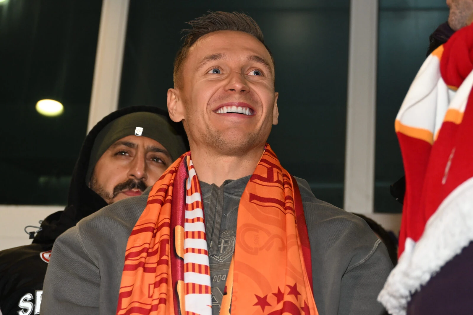 Przemysław Frankowski, the Polish footballer, greets fans at Atatürk Airport after arriving in Istanbul, Türkiye, on February 10, 2025, to join Galatasaray.