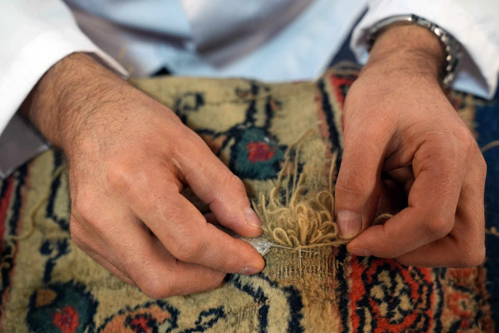 Restoration in progress on two 200-year-old carpets from the Ottoman palace, being prepared for exhibition in Istanbul.