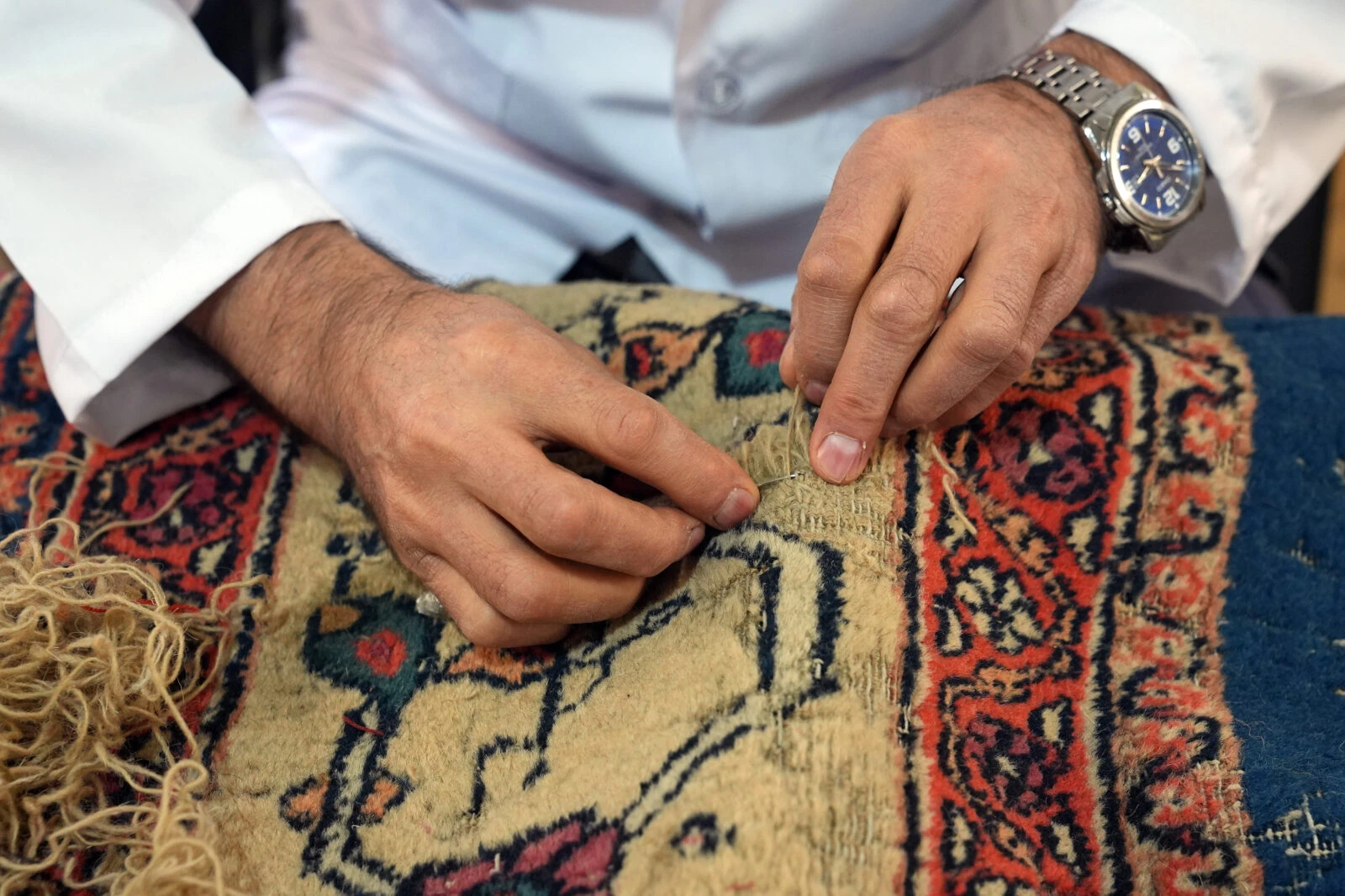 Restoration in progress on two 200-year-old carpets from the Ottoman palace, being prepared for exhibition in Istanbul.