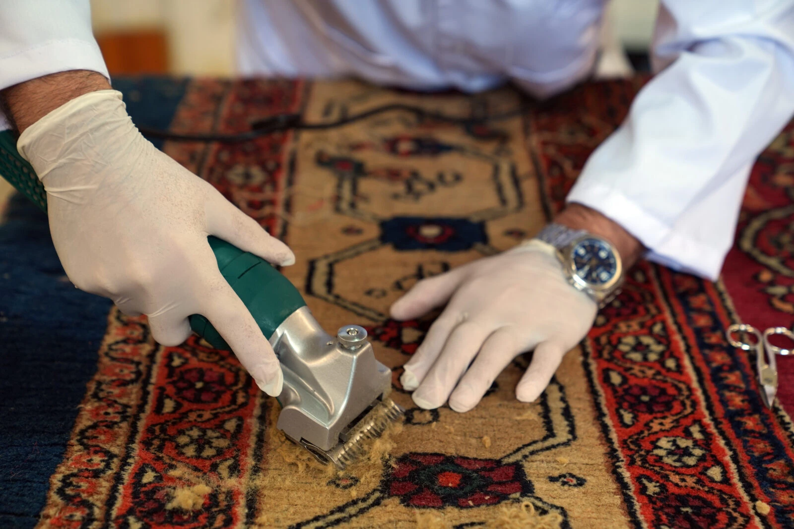 Restoration in progress on two 200-year-old carpets from the Ottoman palace, being prepared for exhibition in Istanbul.