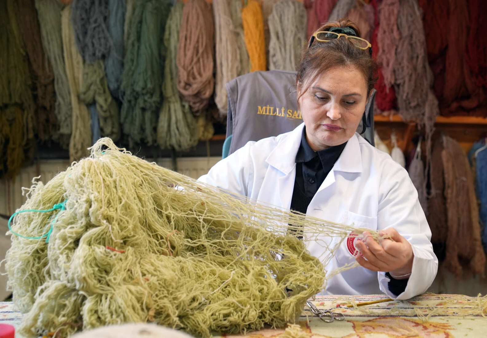 Restoration in progress on two 200-year-old palace carpets from the Ottoman palace, being prepared for exhibition in Istanbul.