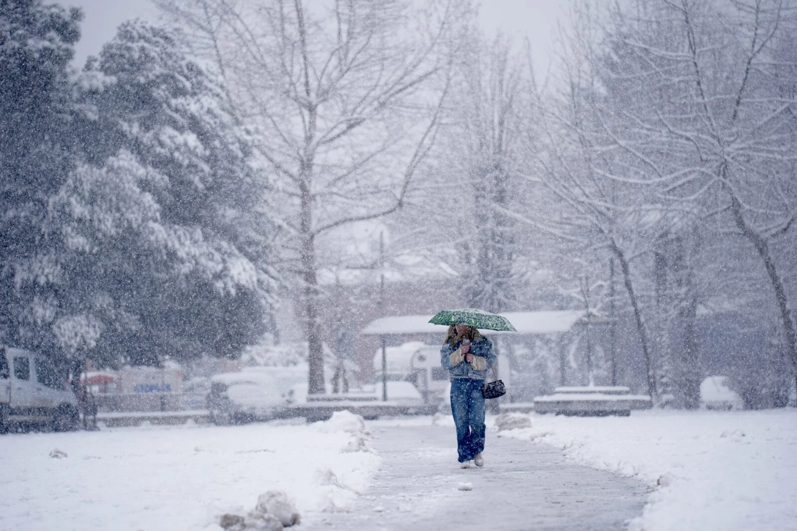 People walking through snowfall in Düzce, Türkiye, on February 21, 2025.