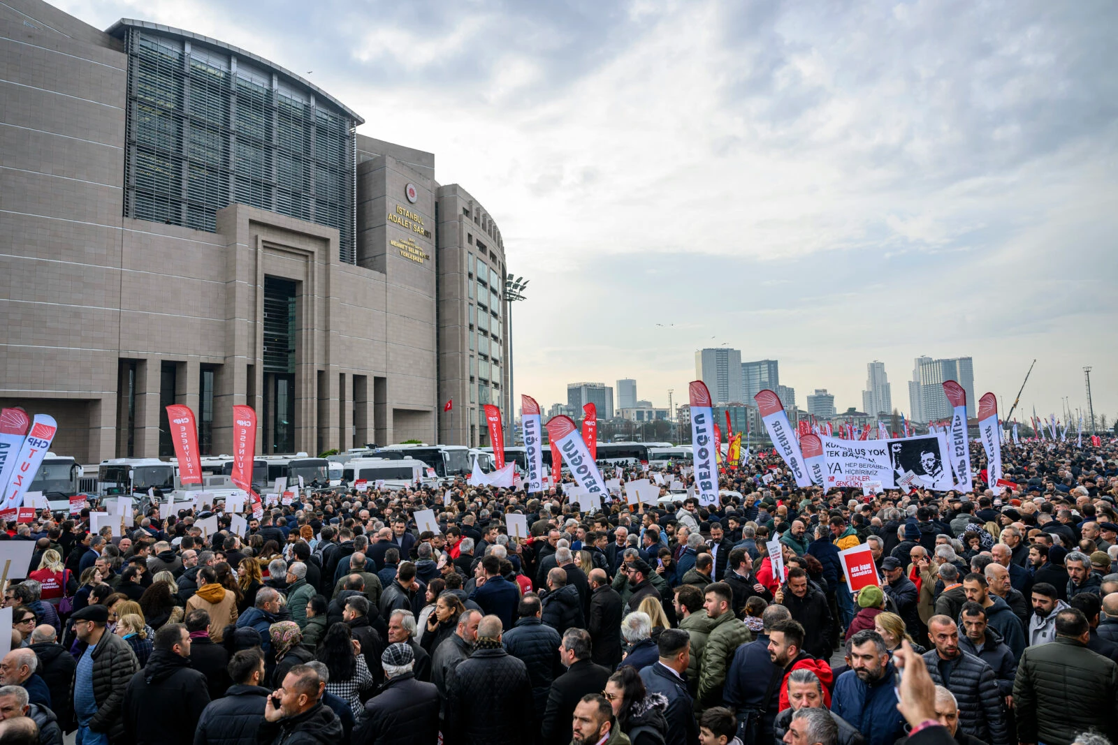 Supporters of Ekrem Imamoglu hold banners