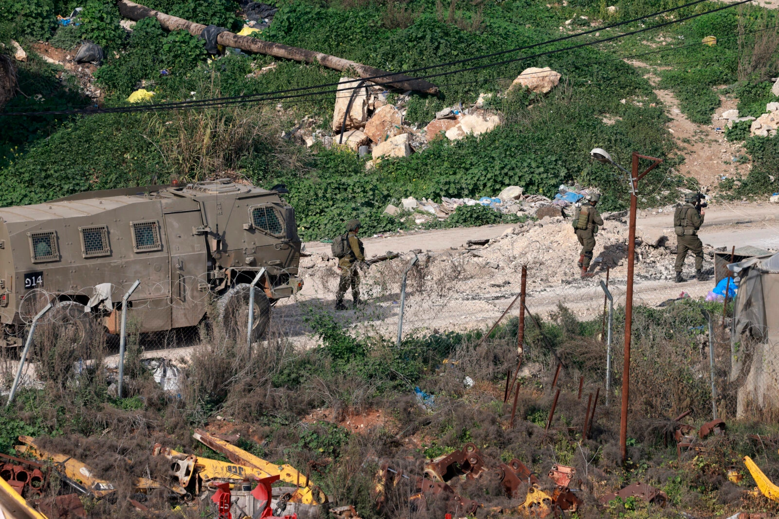 Israeli soldiers walk 