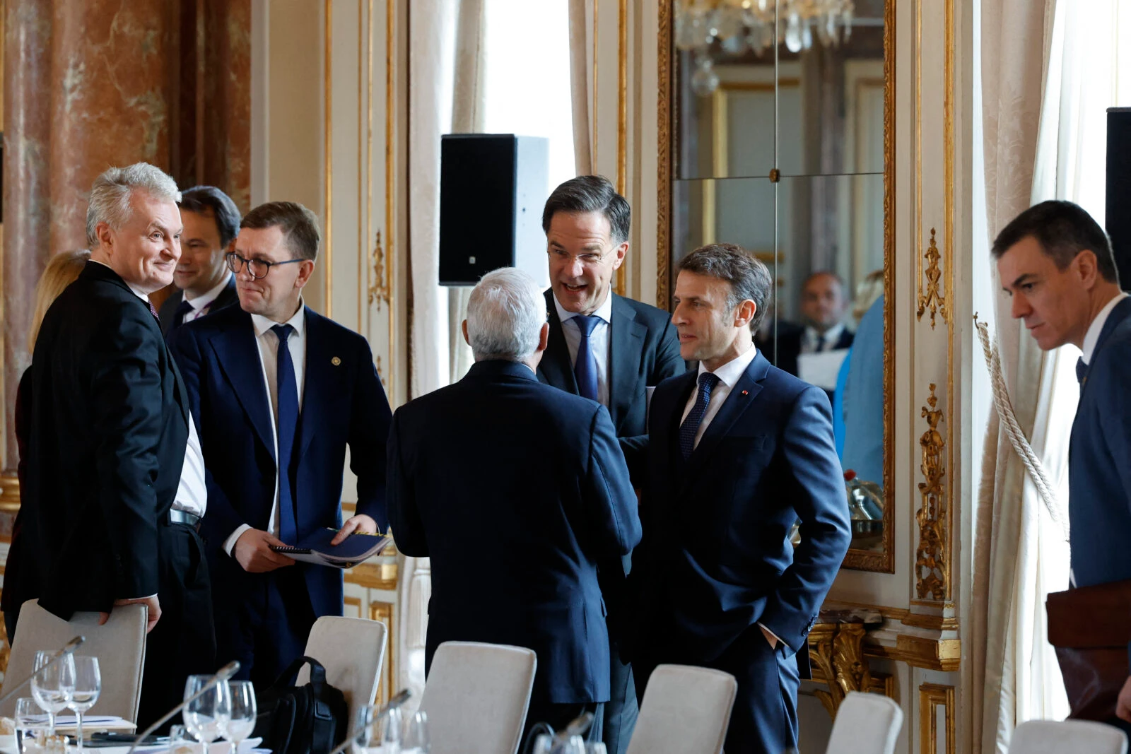 "NATO Secretary General Mark Rutte (C) speaks with French President Emmanuel Macron (CR) and European Council President Antonio Costa (CL) during an informal EU leaders' retreat at the Palais d'Egmont in Brussels