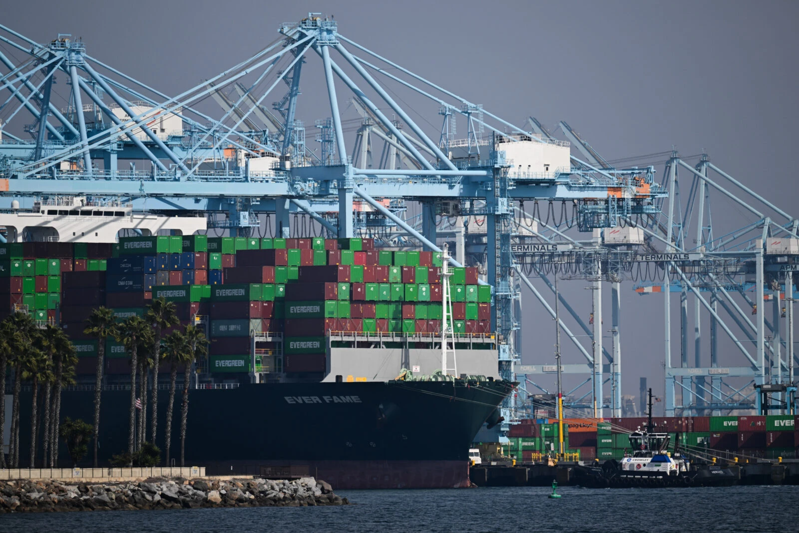 Cargo shipping containers sit on a container ship