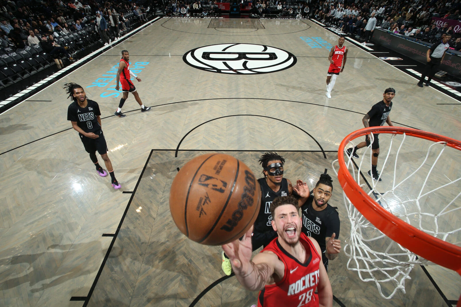 Alperen Şengün of the Houston Rockets drives to the basket against the Brooklyn Nets