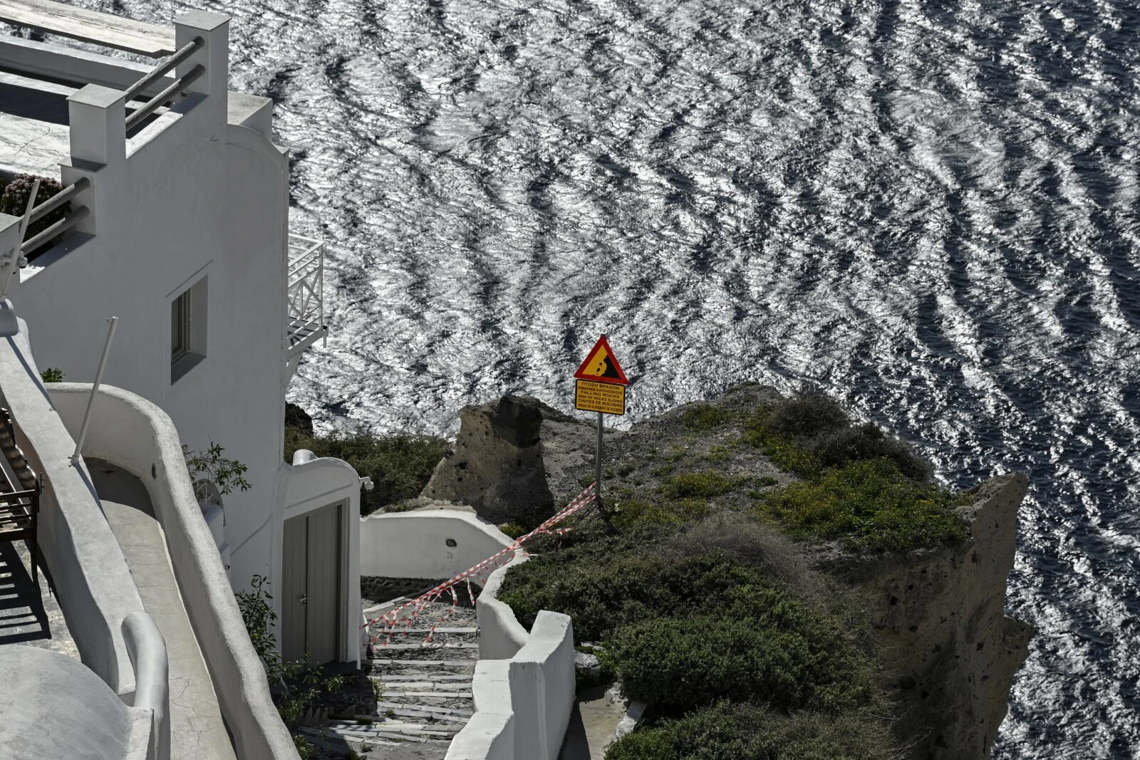 caution tapes placed to restrict access for tourists as a precaution due to recent seismic activities in Oia village, santorini