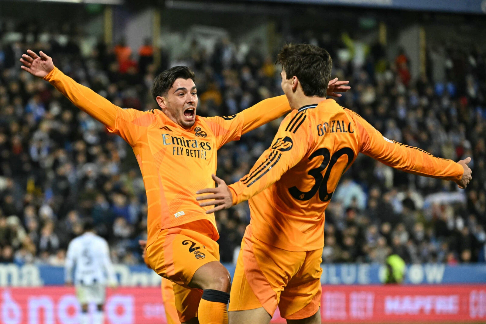 Gonzalo Garcia (R) celebrates with teammate Real Madrid's Moroccan forward #21 Brahim Diaz 