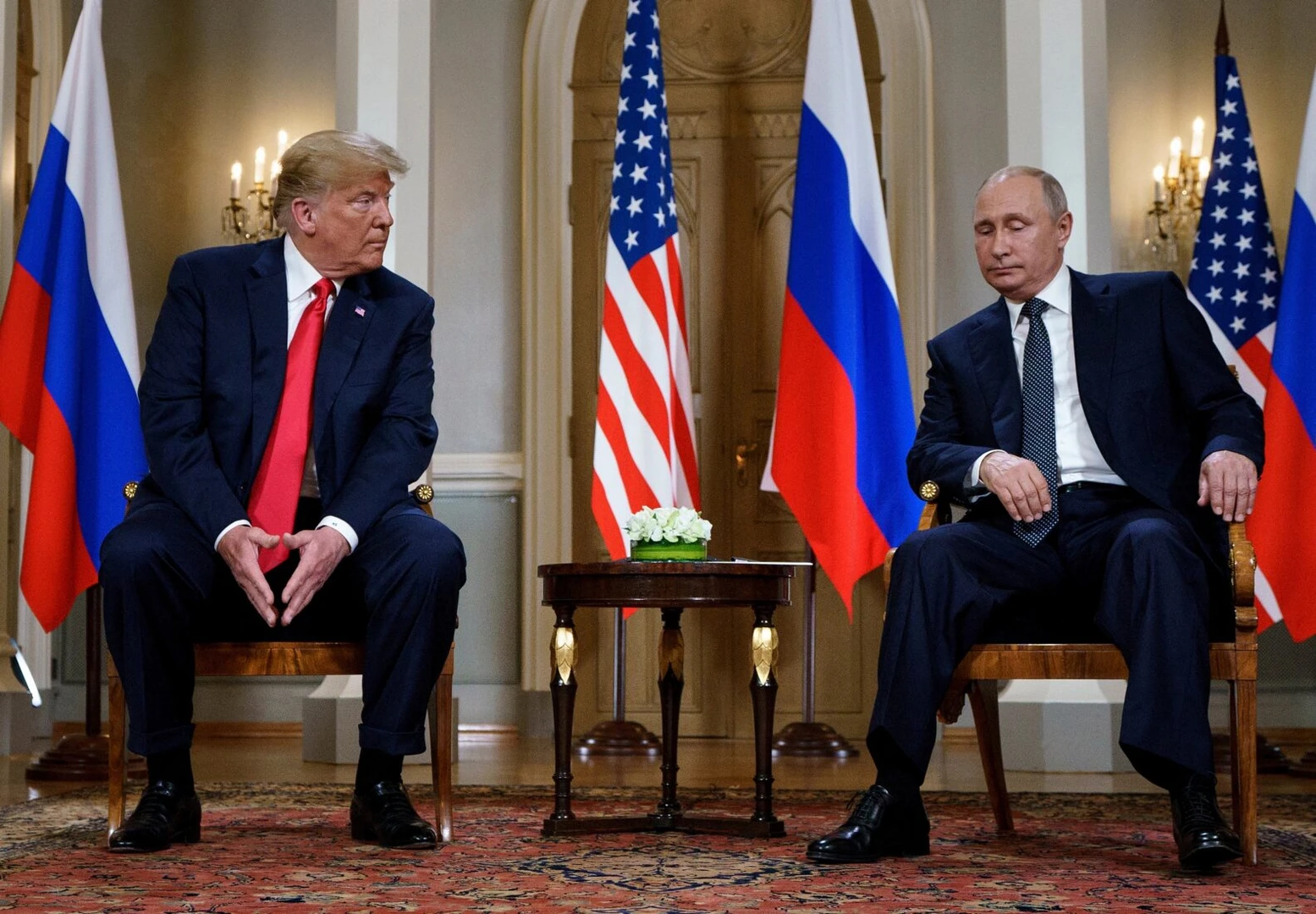 Photo shows Russian president Putin sitting alongside US President Donald Trump in Helsinki