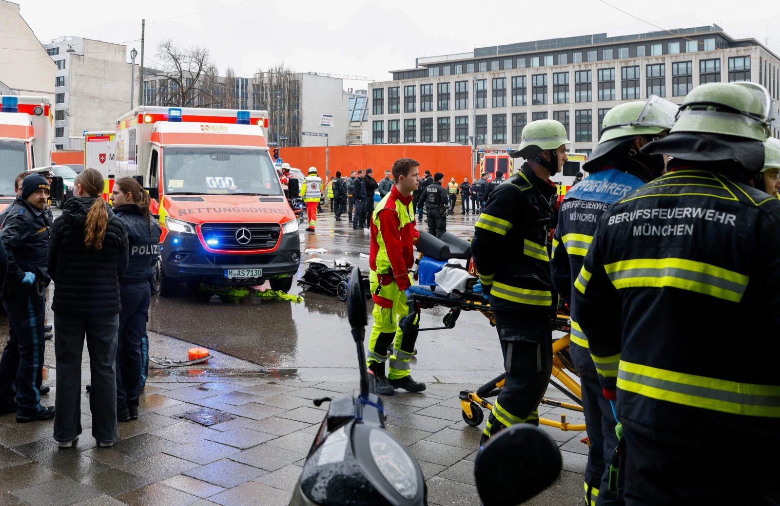 Members of the emergengy services work at the scene