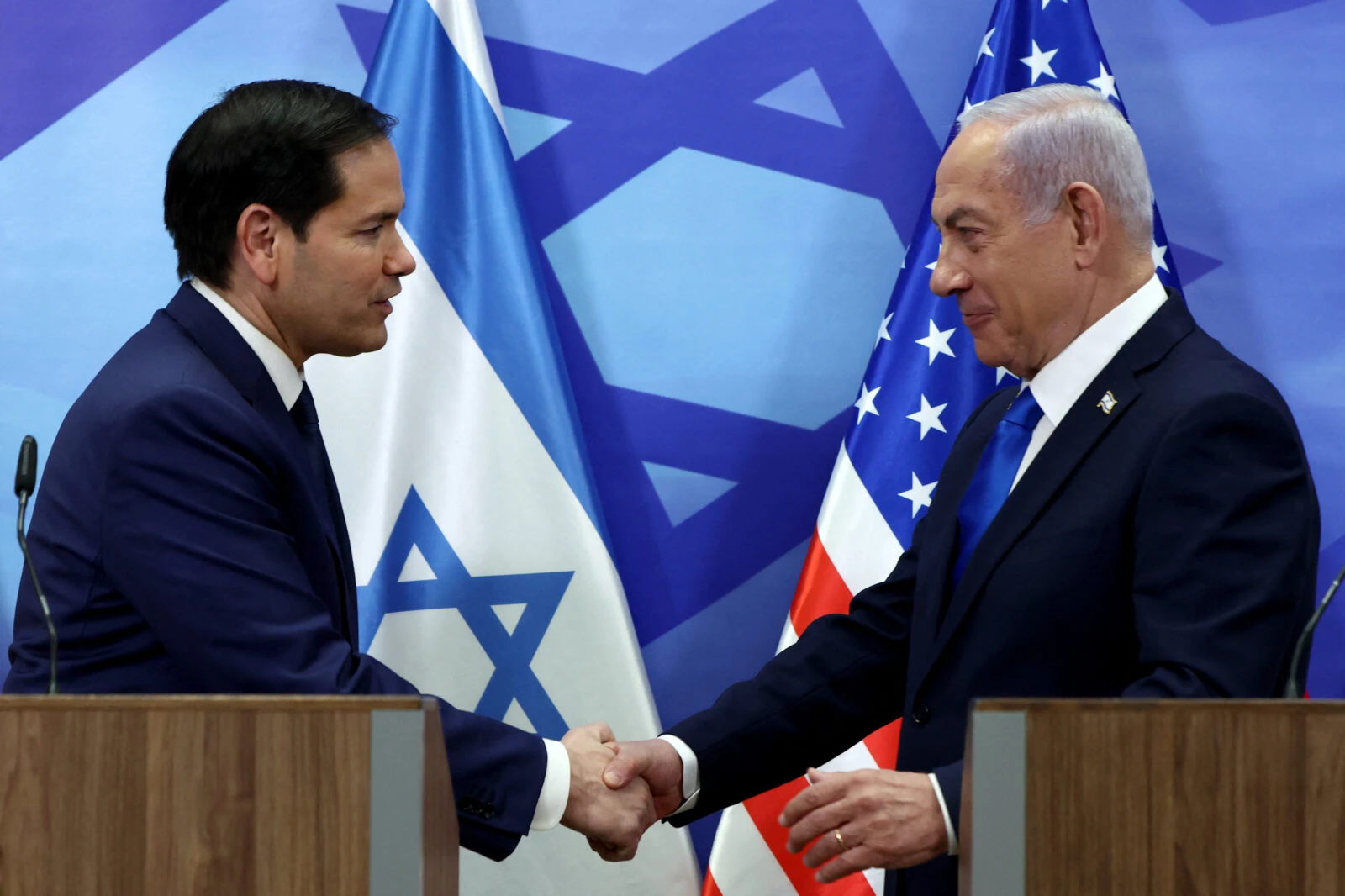 US Secretary of State Marco Rubio and Israeli Prime Minister Benjamin Netanyahu shake hands