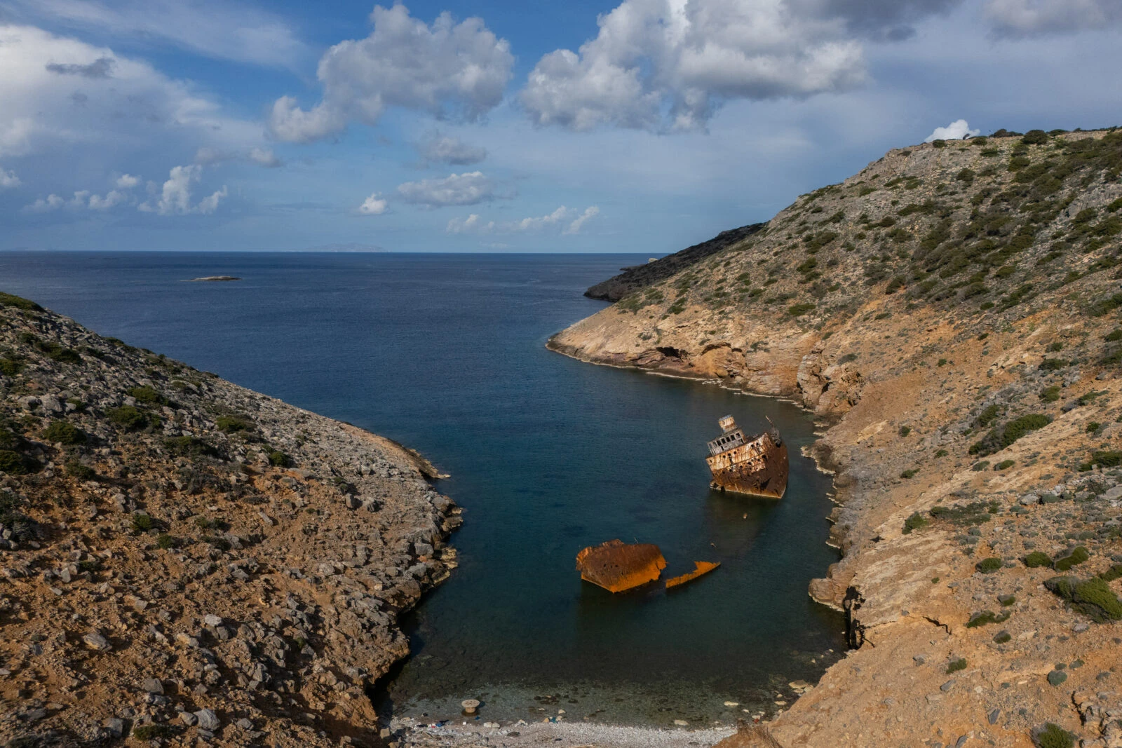 An aerial view shows a creek and the shipwreck of Olympia