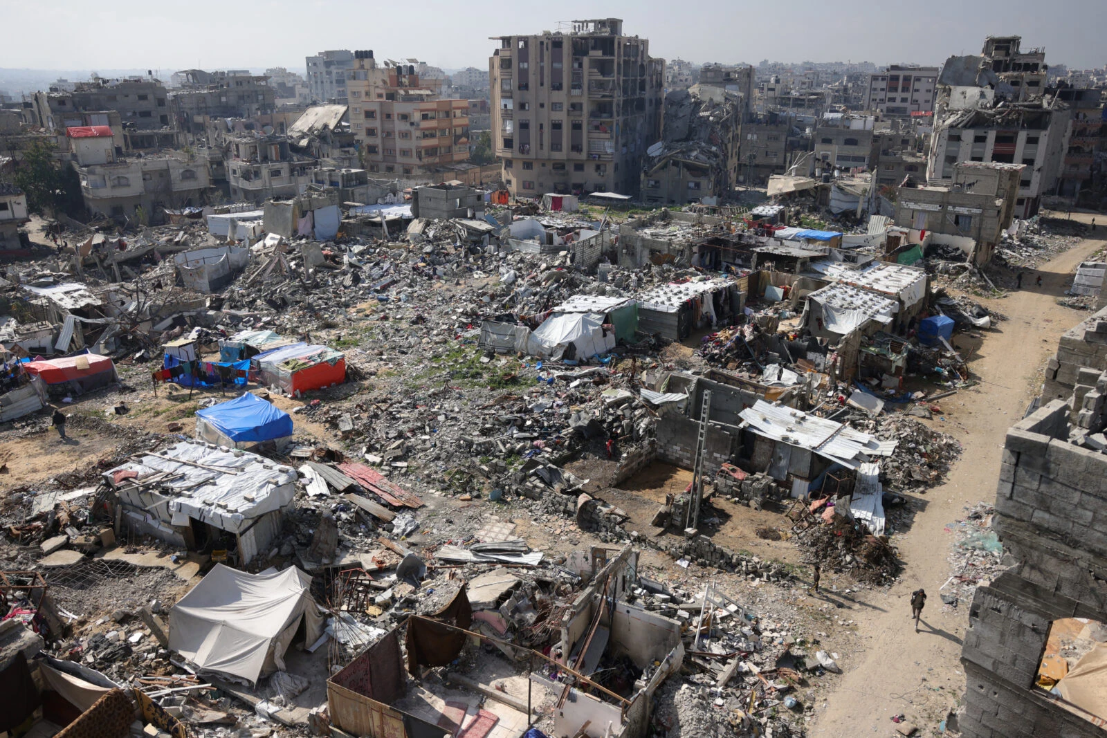 A general view shows tents built next to the rubble of buildings in Jabalia