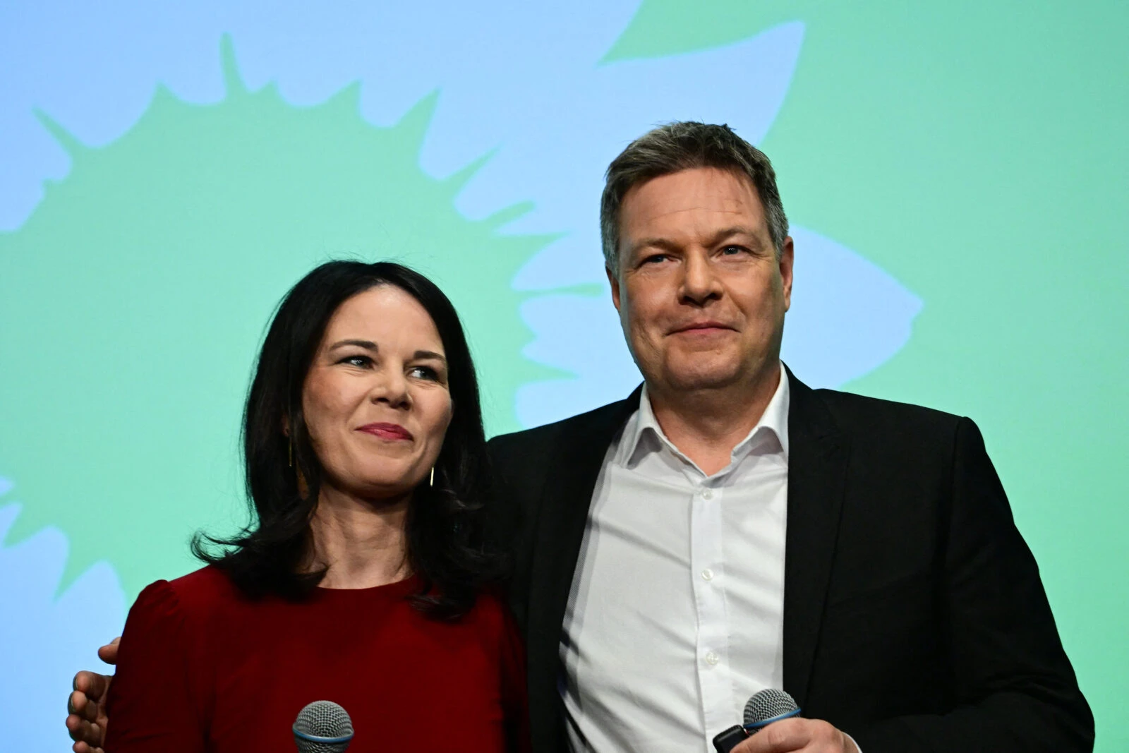 Photo shows German Foreign Minister Annalena Baerbock (L) and German Minister of Economics and Climate Protection and main candidate of Germany's Green party Robert Habeck react during the electoral evening of Germany's The Greens party